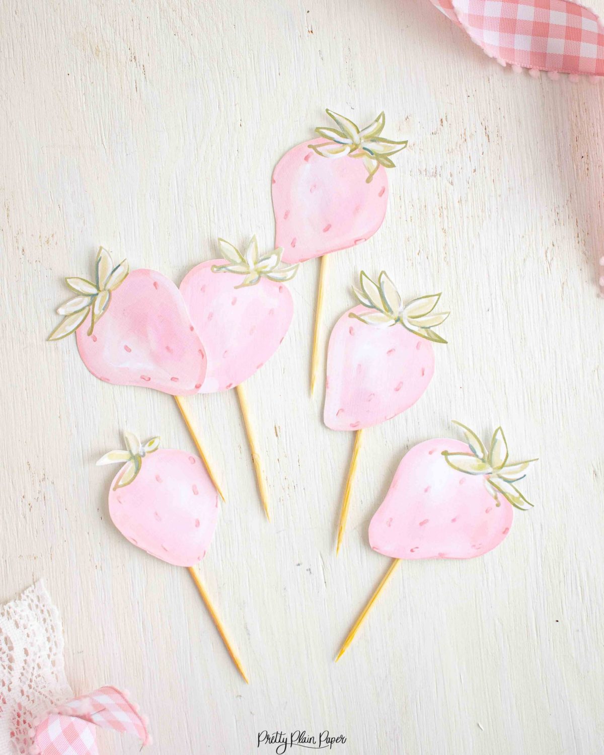 Pink Strawberry Cupcake Toppers with Watercolor Strawberry and Floral & other Birthday Party Decor Printables by Pretty Plain Paper, Strawberry Theme Birthday Party Decor