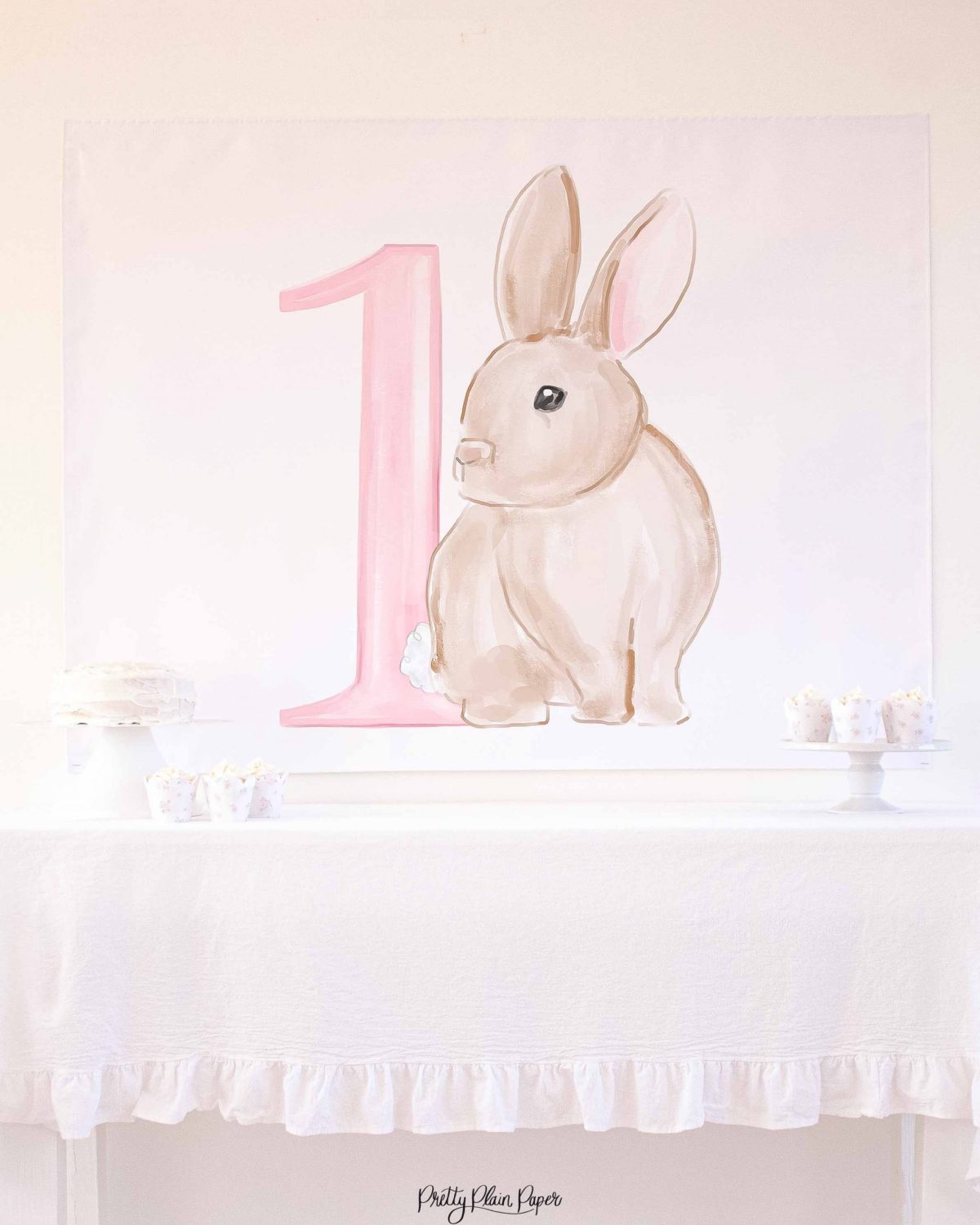 Watercolor Pink Floral Bunny Birthday Party Backdrop by Pretty Plain Paper for a Some Bunny is One Birthday Party or a Bunny Birthday Theme