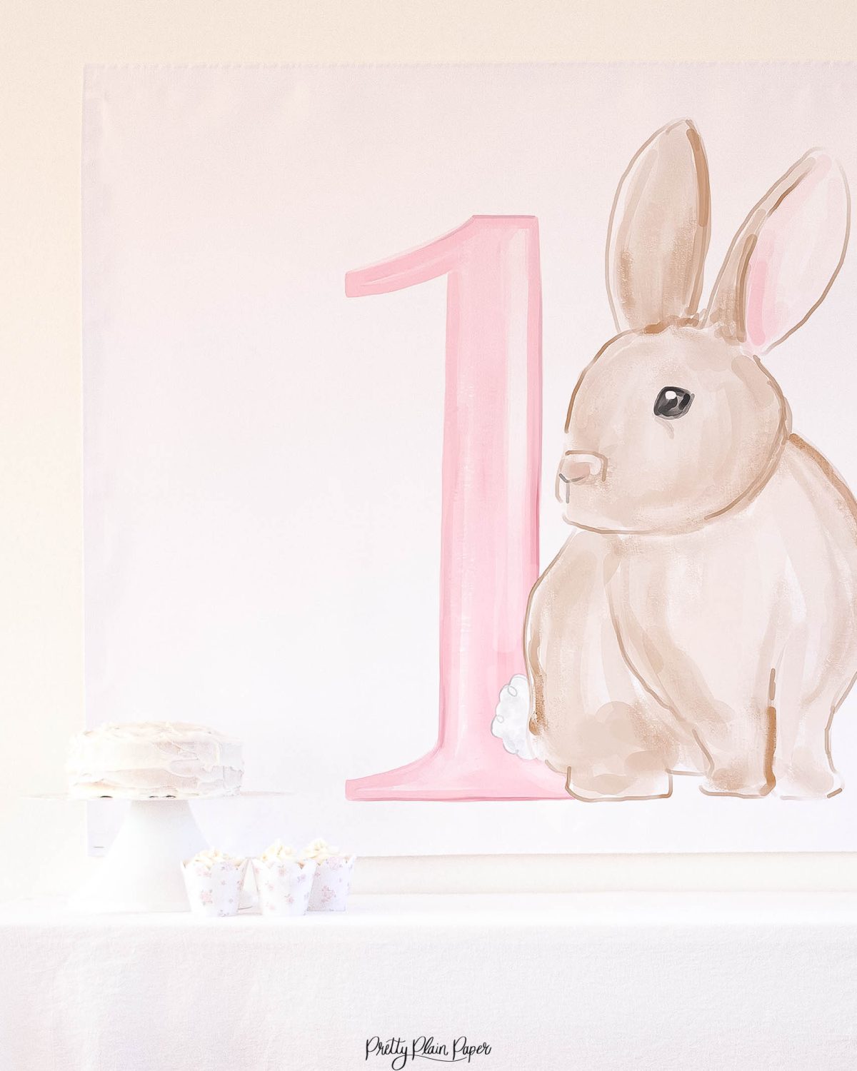 Watercolor Pink Floral Bunny Birthday Party Backdrop by Pretty Plain Paper for a Some Bunny is One Birthday Party or a Bunny Birthday Theme