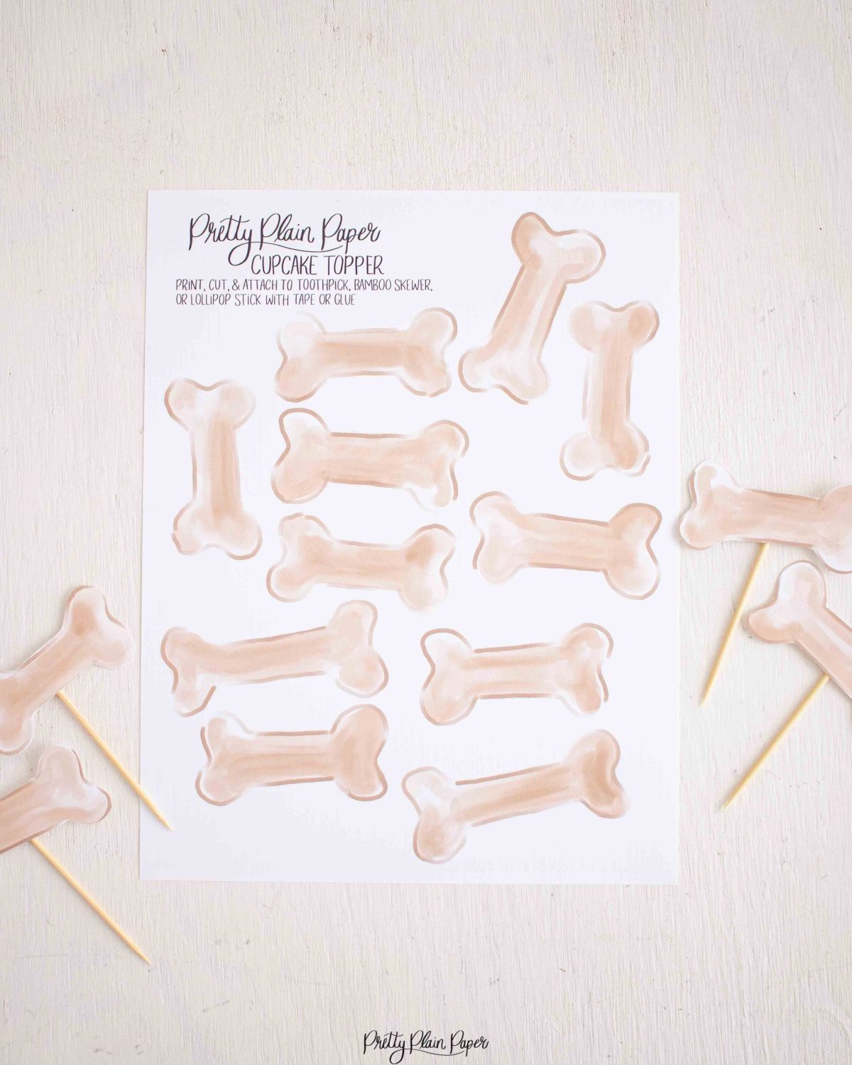 Puppy Dog Bone Cupcake Toppers for a Snips and Snails and Puppy Dog Tails Birthday by Pretty Plain Paper