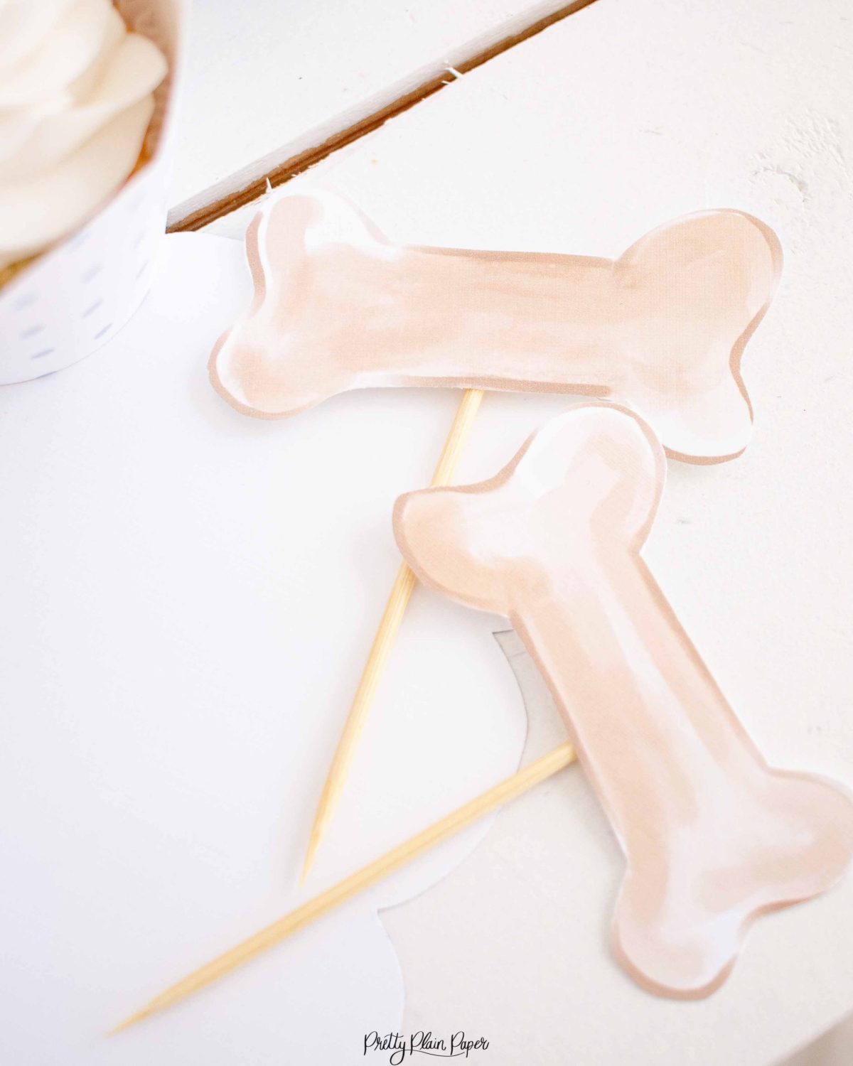 Puppy Dog Bone Cupcake Toppers for a Snips and Snails and Puppy Dog Tails Birthday by Pretty Plain Paper