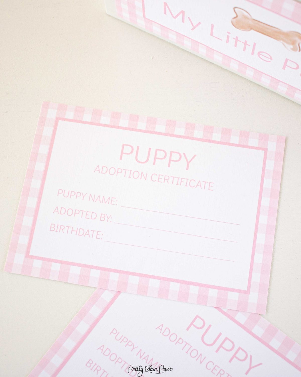 Adopt a Puppy Certificate for a Pink Gingham Puppy Party Favor or Party Activity by Pretty Plain Paper; A Watercolor Pink Puppy Party Set