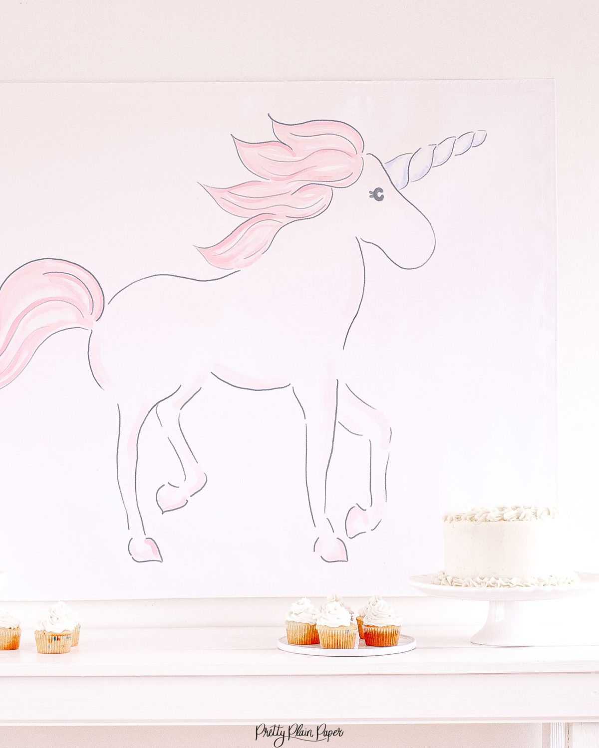 Watercolor Pink Unicorn Party Backdrop by Pretty Plain Paper for a Pink Unicorn Birthday or a Pink Unicorn Baby Shower
