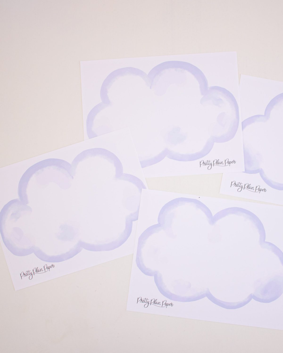 Watercolor Clouds Centerpieces by Pretty Plain Paper for a Rainbow and Unicorn Birthday Party