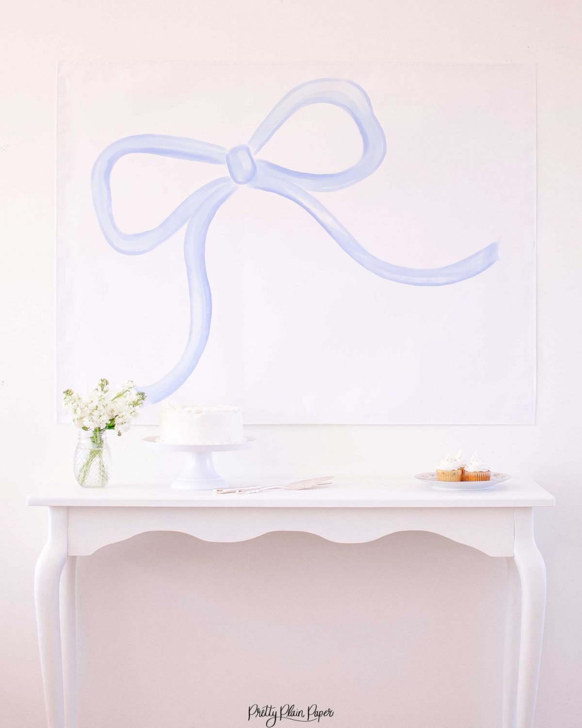 Watercolor Blue Bow Backdrop for a Blue Bow Birthday Party, Baby Shower, or Bridal Shower by Pretty Plain Paper