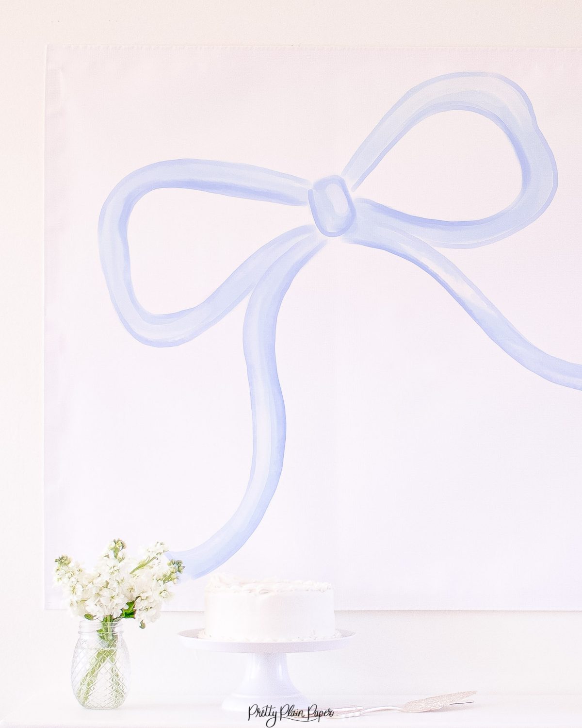 Watercolor Blue Bow Backdrop for a Blue Bow Birthday Party, Baby Shower, or Bridal Shower by Pretty Plain Paper