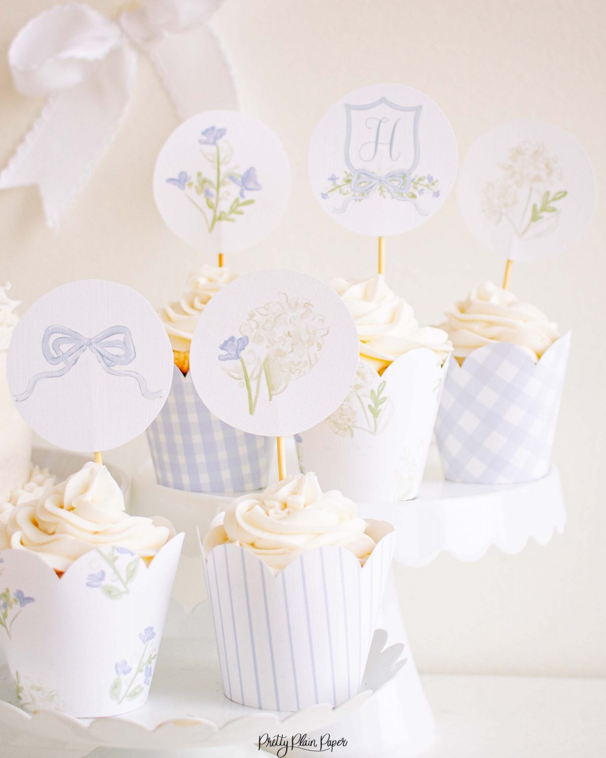 Monogram Crest, Blue Floral and Blue Bow Cupcake Wrapper Printable by Pretty Plain Paper