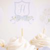 Monogram Crest, Blue Floral and Blue Bow Cupcake Wrapper Printable by Pretty Plain Paper