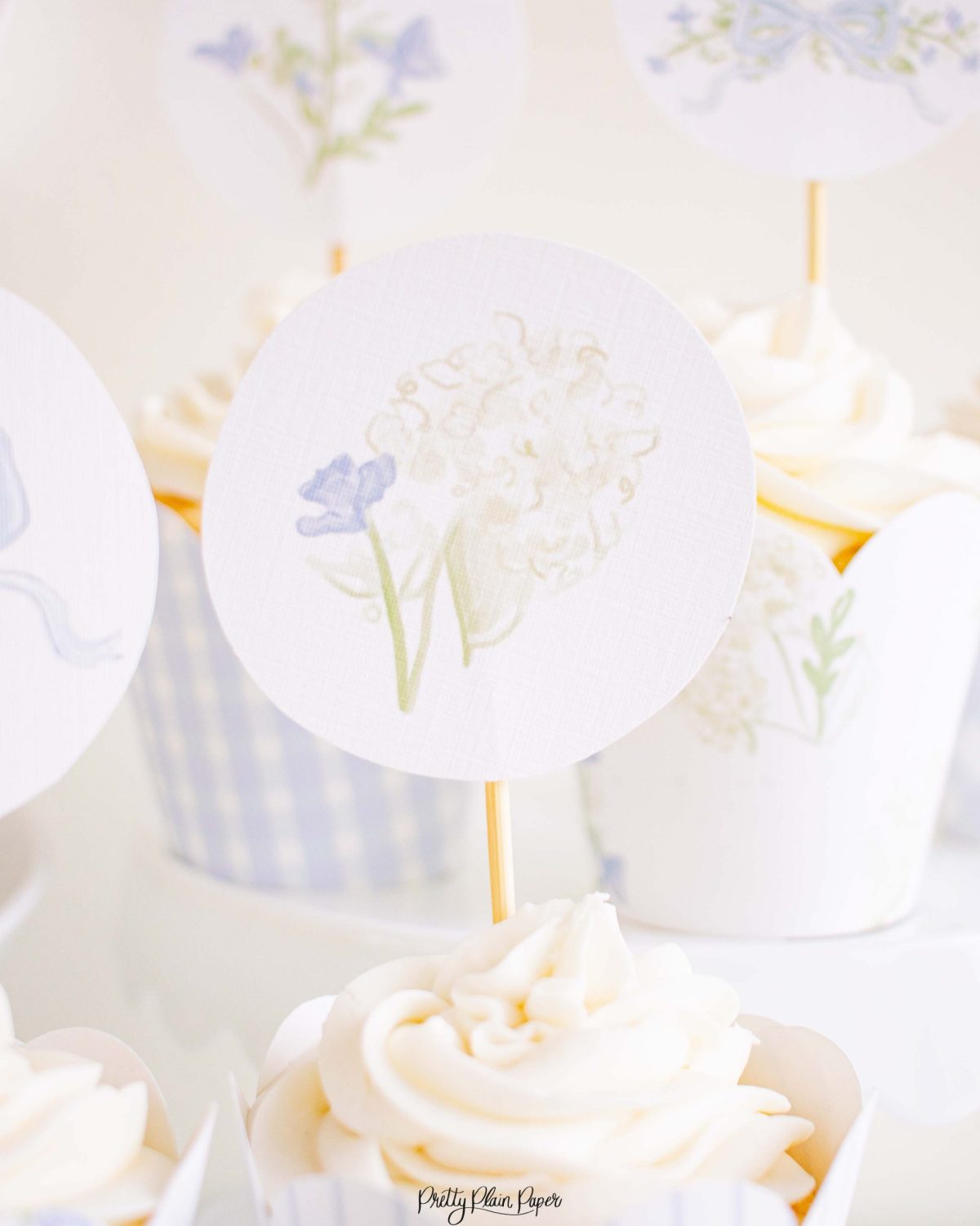 Monogram Crest, Blue Floral and Blue Bow Cupcake Wrapper Printable by Pretty Plain Paper