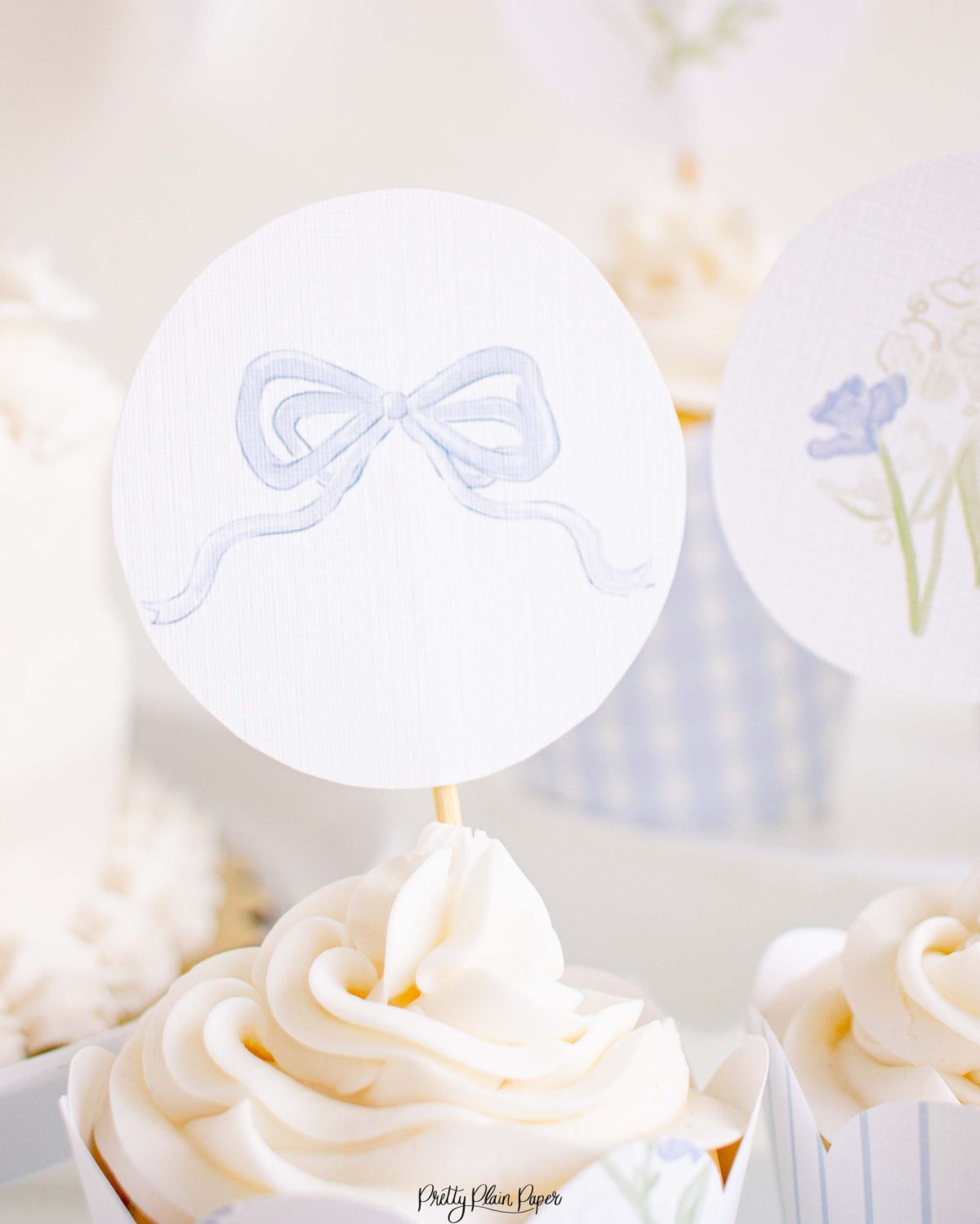 Monogram Crest, Blue Floral and Blue Bow Cupcake Wrapper Printable by Pretty Plain Paper