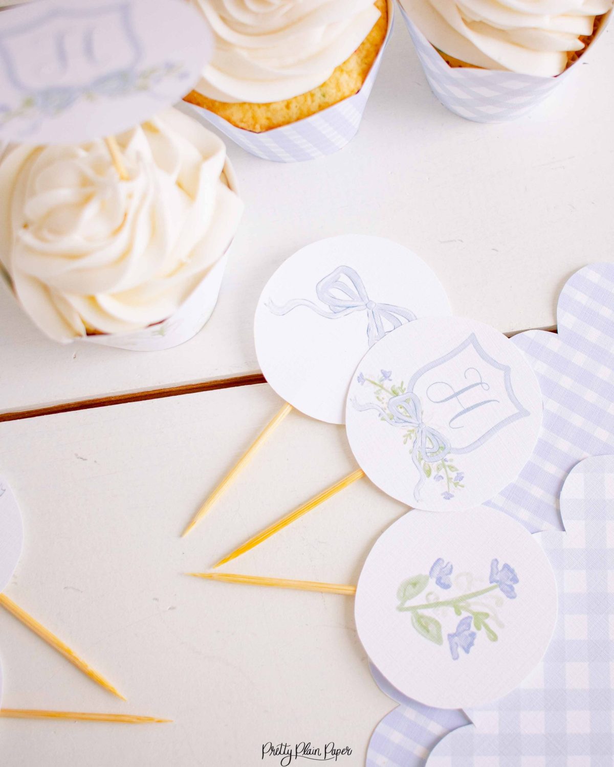 Monogram Crest, Blue Floral and Blue Bow Cupcake Wrapper Printable by Pretty Plain Paper