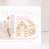 Watercolor Christmas Card with Photo by Pretty Plain Paper a Grandmillennial Christmas Card with Pink Gingerbread House with Bow and Monogram Crest