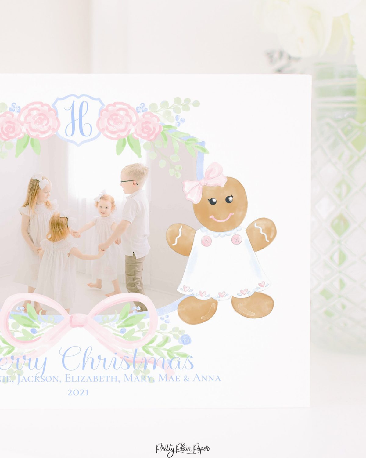 Watercolor Christmas Card with Photo by Pretty Plain Paper a Grandmillennial Christmas Card with Blue Gingerbread Boy and Pink Gingerbread Girl and Monogram Crest