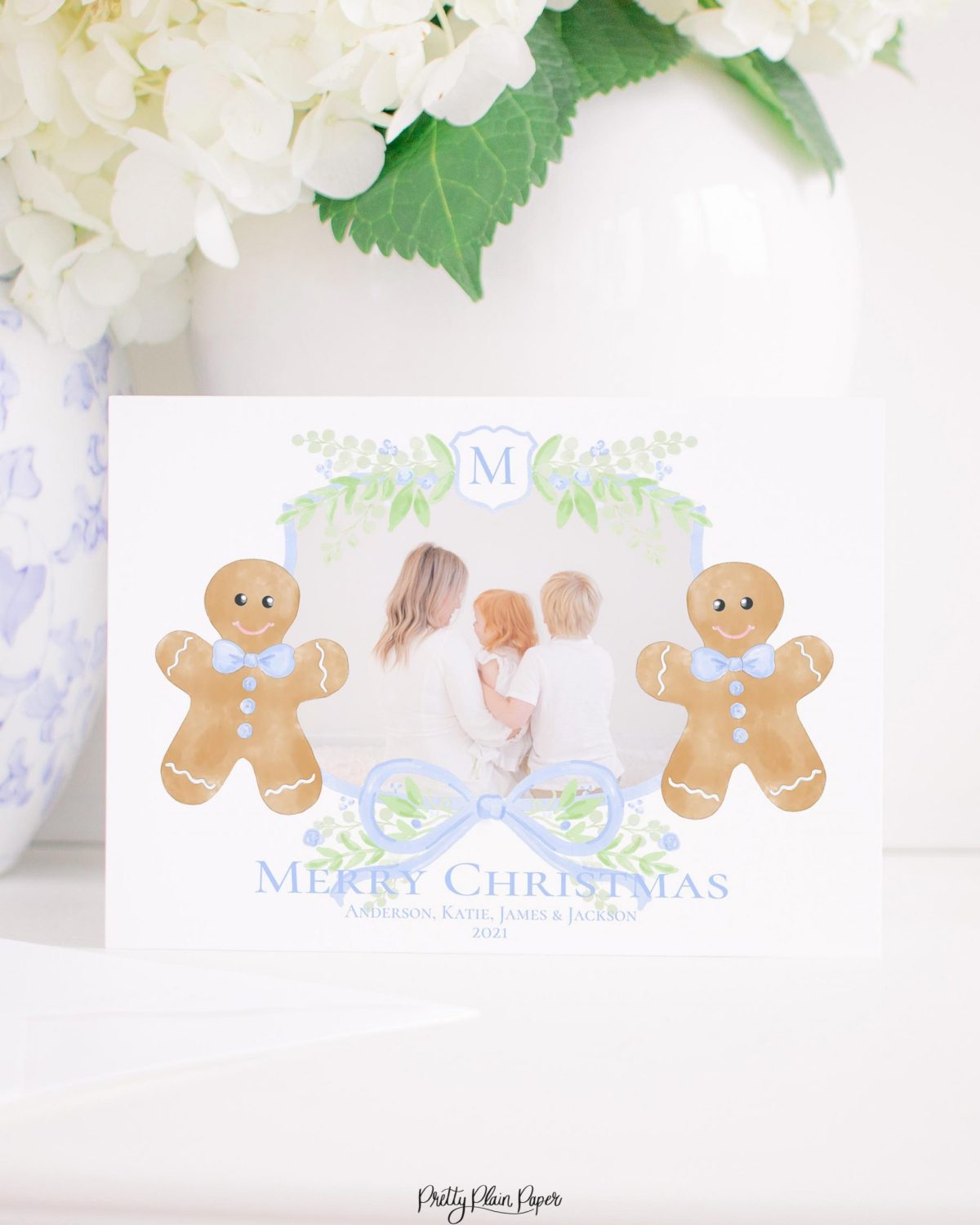 Watercolor Christmas Card with Photo by Pretty Plain Paper a Grandmillennial Christmas Card with Blue Gingerbread Boys and Monogram Crest