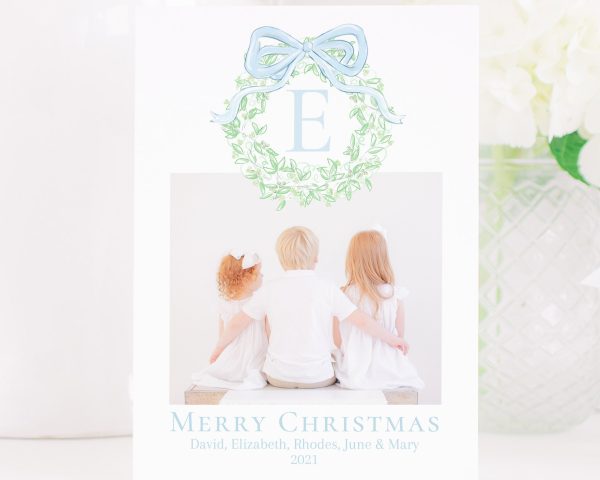 Watercolor Christmas Card with Photo by Pretty Plain Paper a Grandmillennial Christmas Card with Blue Bow and Monogram Wreath Crest with Greenery